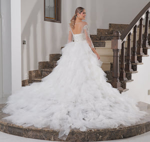 Vestido de novia corte sirena con pedreria de manga larga